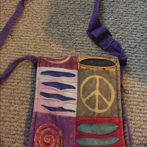 Purple purse with a peace sign